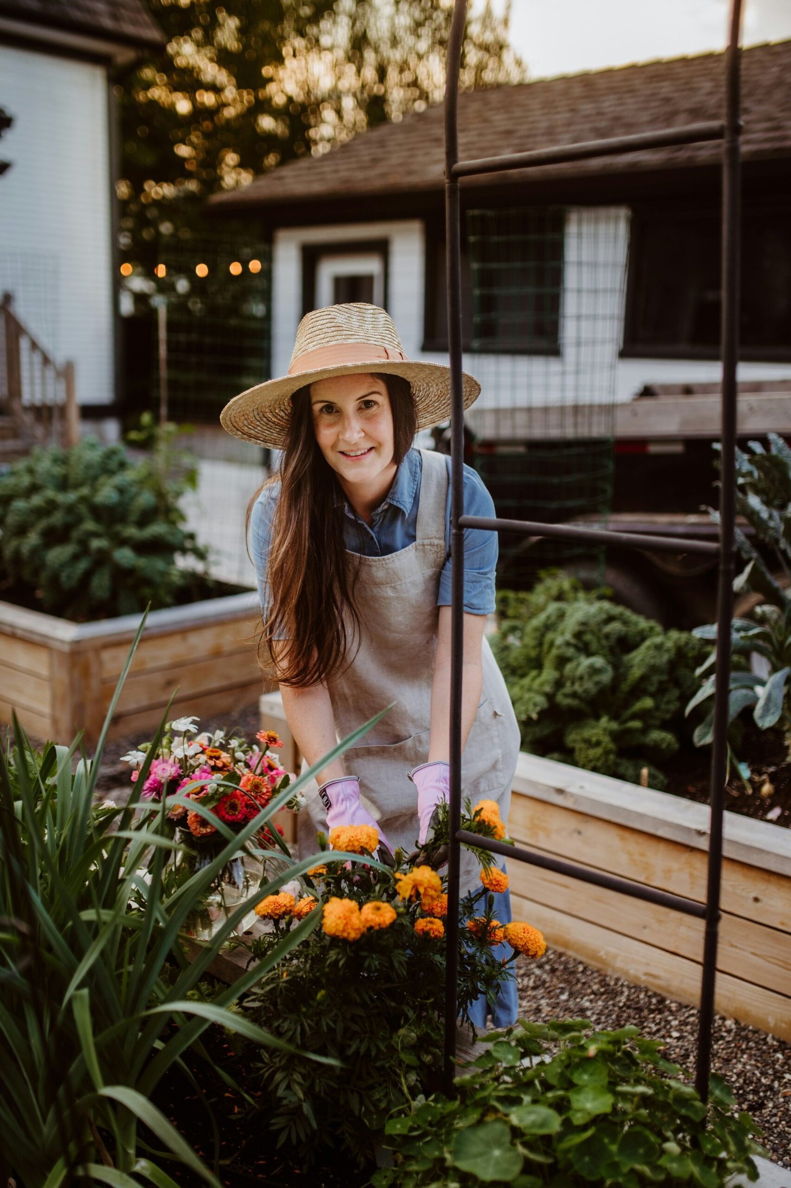 Gardener working on her raised bed garden