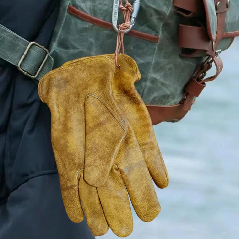 leather gloves attached to a persons jeans